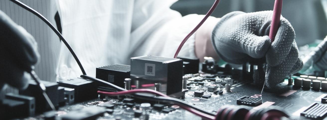 Engineer testing GPU server board at Antergy repair facility